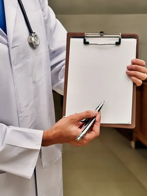 Doctor Holding Clipboard FREE Stock Photo, doctor,  clipboard,  healthcare picture